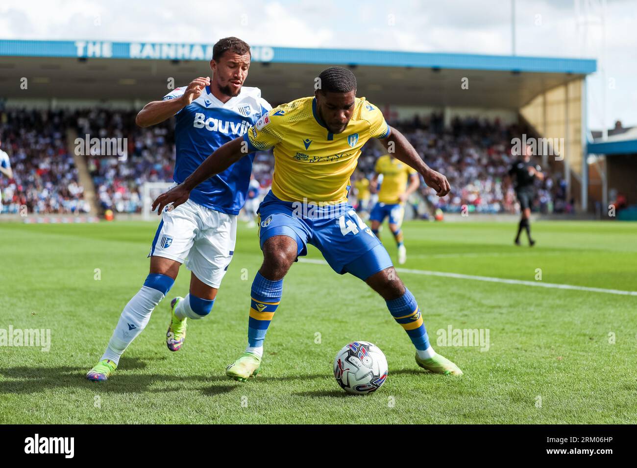 Colchester United's Jayden Fevrier and Gillingham's Ashley Nadesan battle for the ball during the Sky Bet League Two match at Priestfield Stadium, Gillingham. Picture date: Saturday August 26, 2023. Stock Photo