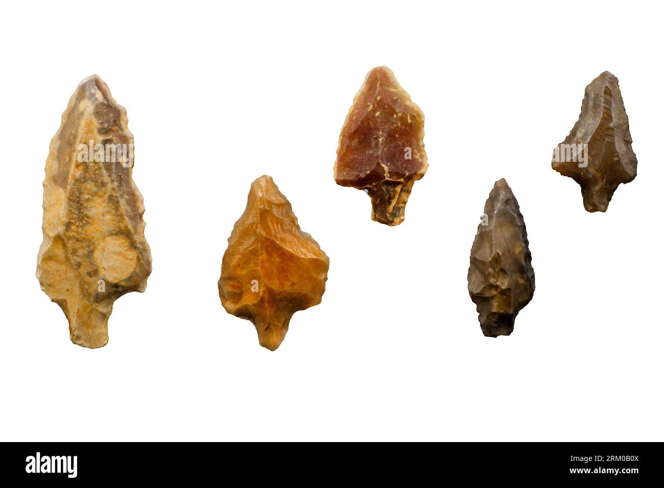 Collection of Paleolithic tanged points made of flint from the Pleistocene / Ice Age / Glacial Epoch found in Morocco against white background Stock Photo