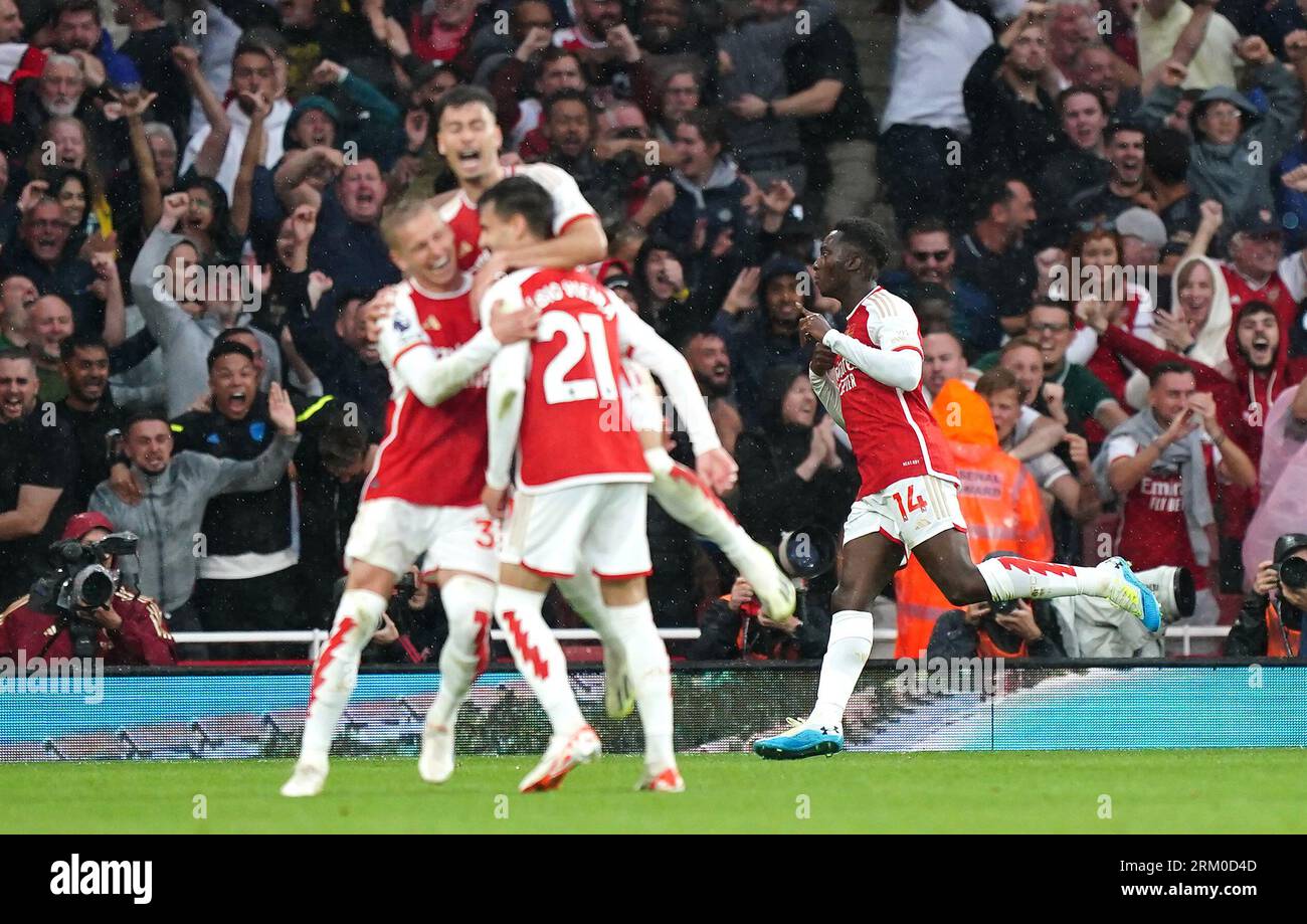 Arsenal's Eddie Nketiah (right) celebrates scoring their side's second goal of the game with team-mates during the Premier League match at the Emirates Stadium, London. Picture date: Saturday August 26, 2023. Stock Photo