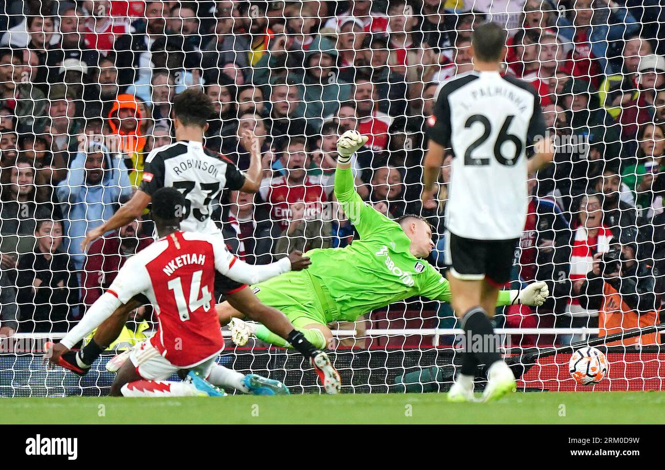 Arsenal's Eddie Nketiah (left) scores their side's second goal of the game during the Premier League match at the Emirates Stadium, London. Picture date: Saturday August 26, 2023. Stock Photo
