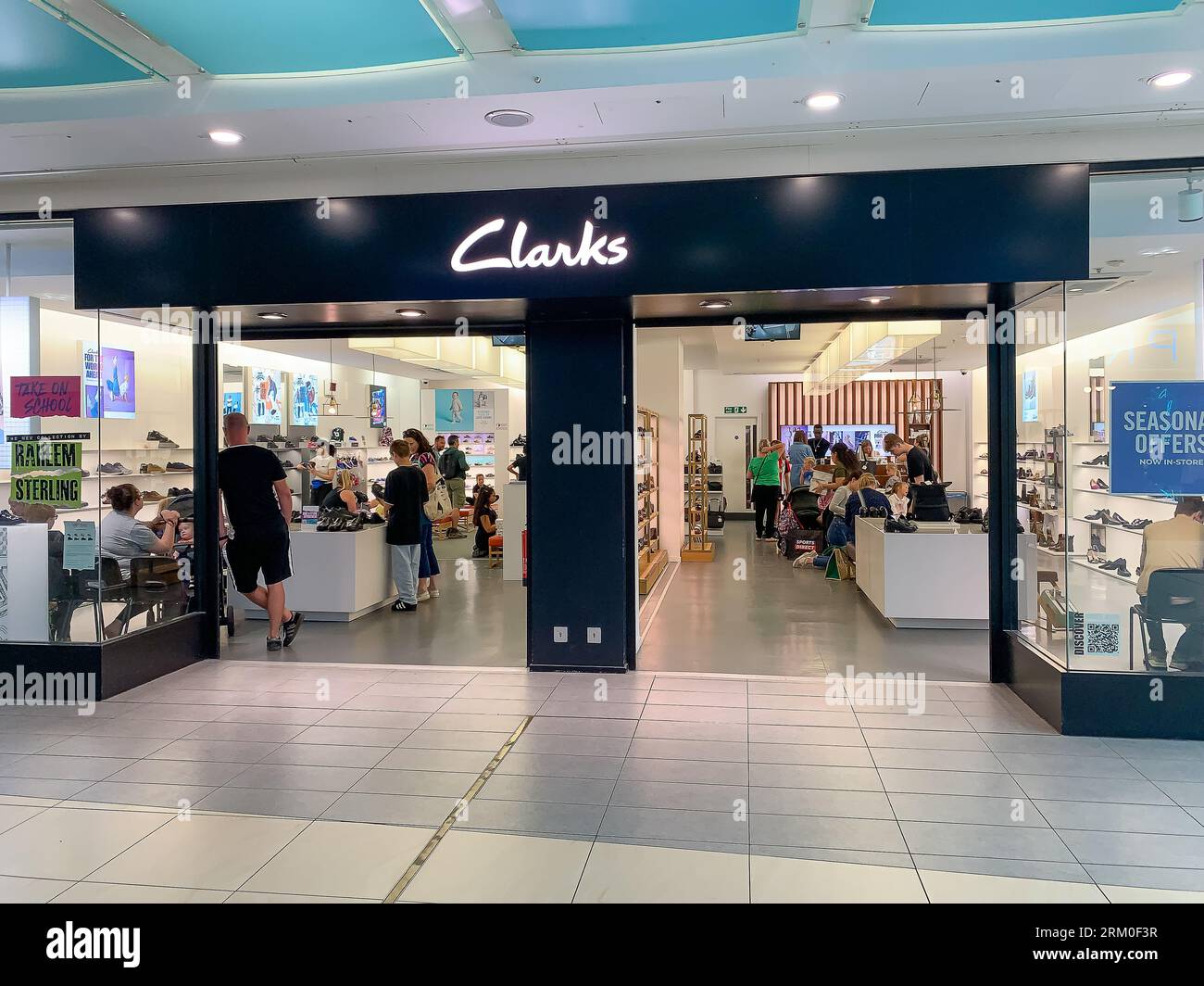 Staines-upon-Thames, Surrey, UK. 26th August, 2023. A busy day at the Clarks shoe shop in Staines-upon-Thames, Surrey as children get fitted for new shoes before returning to school. Credit: Maureen McLean/Alamy Live News Stock Photo