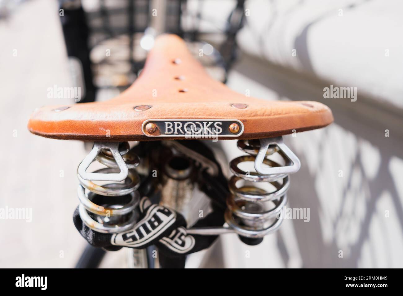 Copenhagen, Denmark - August 8, 2023: Detail of a leather bike saddle, Brooks brand Stock Photo