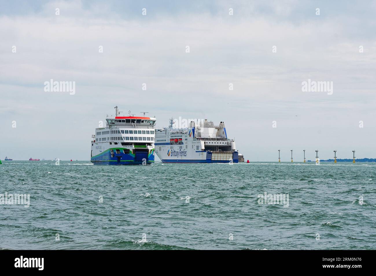 Two car ferries passing in opposite directions outside the entrance to Portsmouth Harbour Hampshire England UK Stock Photo