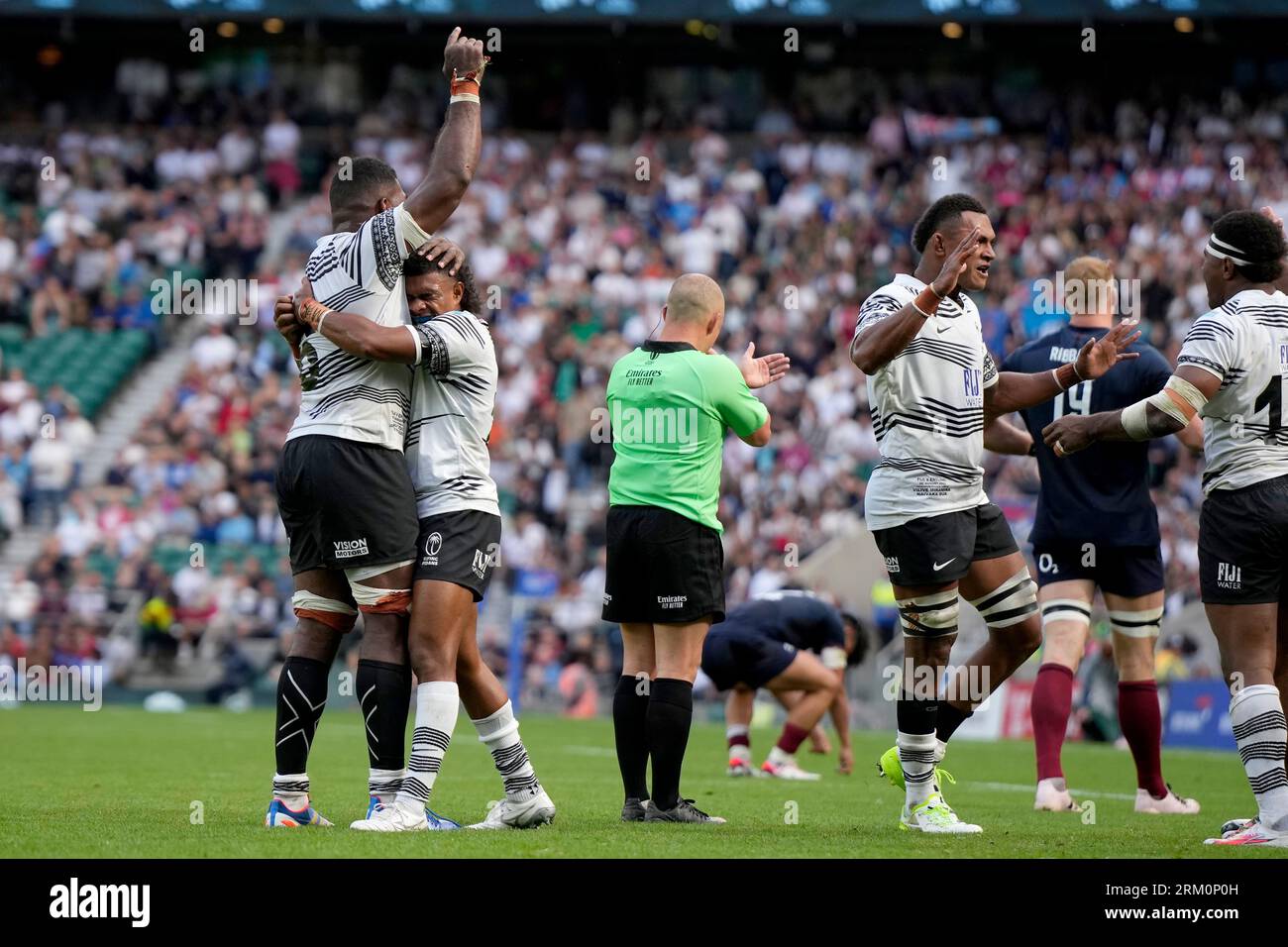 Fijis players celebrate at the rugby union international match between England and Fiji at Twickenham stadium in London, Saturday, Aug. 26, 2023