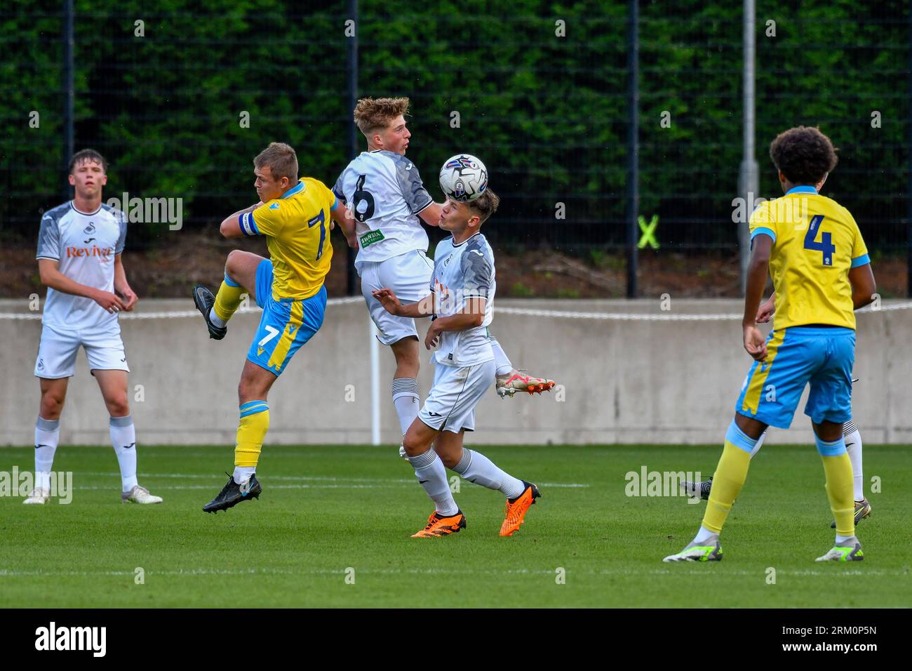 Swansea, Wales. 4 February 2023. Aimar Govea of Swansea City under pressure  from Finley Cotton of Millwall during the Professional Development League  game between Swansea City Under 18 and Millwall Under 18