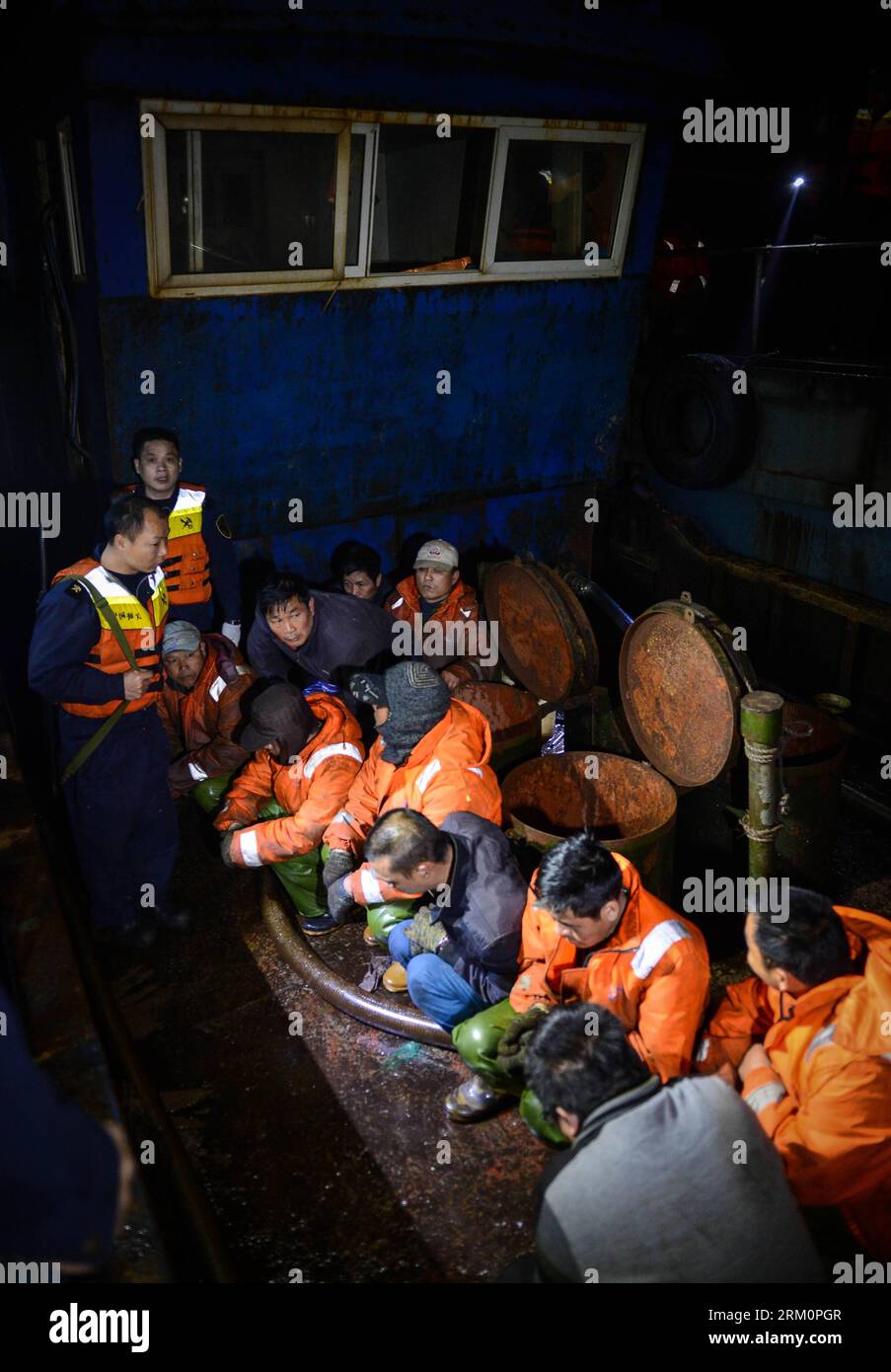 Bildnummer: 59463485  Datum: 29.03.2013  Copyright: imago/Xinhua Photo taken on March 29, 2013 shows police watching over smugglers on a boat offshore east China s Zhejiang Province. A gangs smuggling case involving 15,000 tons of refined oil worthy over 100 million Yuan (approximately 15.9 million U.S. dollars) was seized here on Sunday, as announced by Hangzhou customs on March 31, it is the biggest ever gangs smuggling case offshore Zhejiang province. (Xinhua/Xu Yu) (cxy) CHINA-ZHEJIANG-GANGS SMUGGLING CASE (CN) PUBLICATIONxNOTxINxCHN Gesellschaft Wirtschaft Kriminalität Öl Ölschmuggel Schm Stock Photo