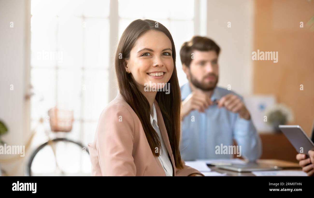 Portrait of smiling caucasian female employee posing in office Stock ...