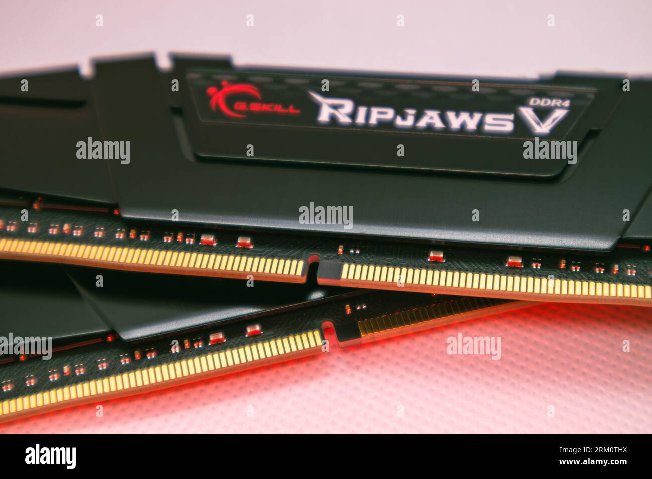 Kyiv, Ukraine - January 05, 2022: G.Skill Ripjaws V series DDR4 DRAM memory modules in red color. Computer RAM chip close-up on white. PC memory parts Stock Photo