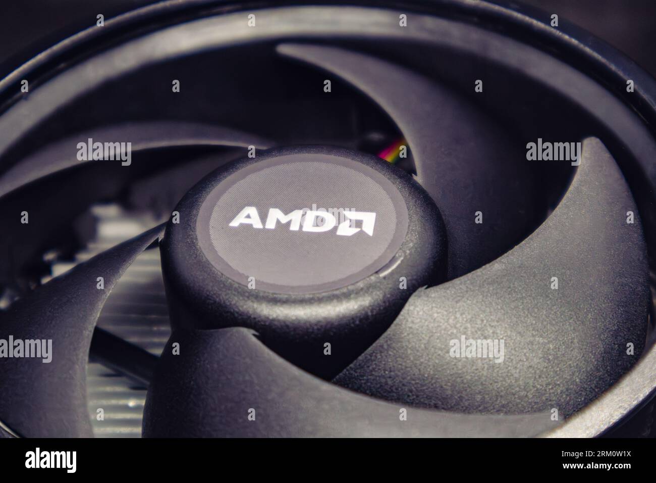 Kyiv, Ukraine - January 05, 2022: AMD cooling radiator for desktop PC CPU unit close-up. Black cooler fan, PC hardware details. Components from modern Stock Photo