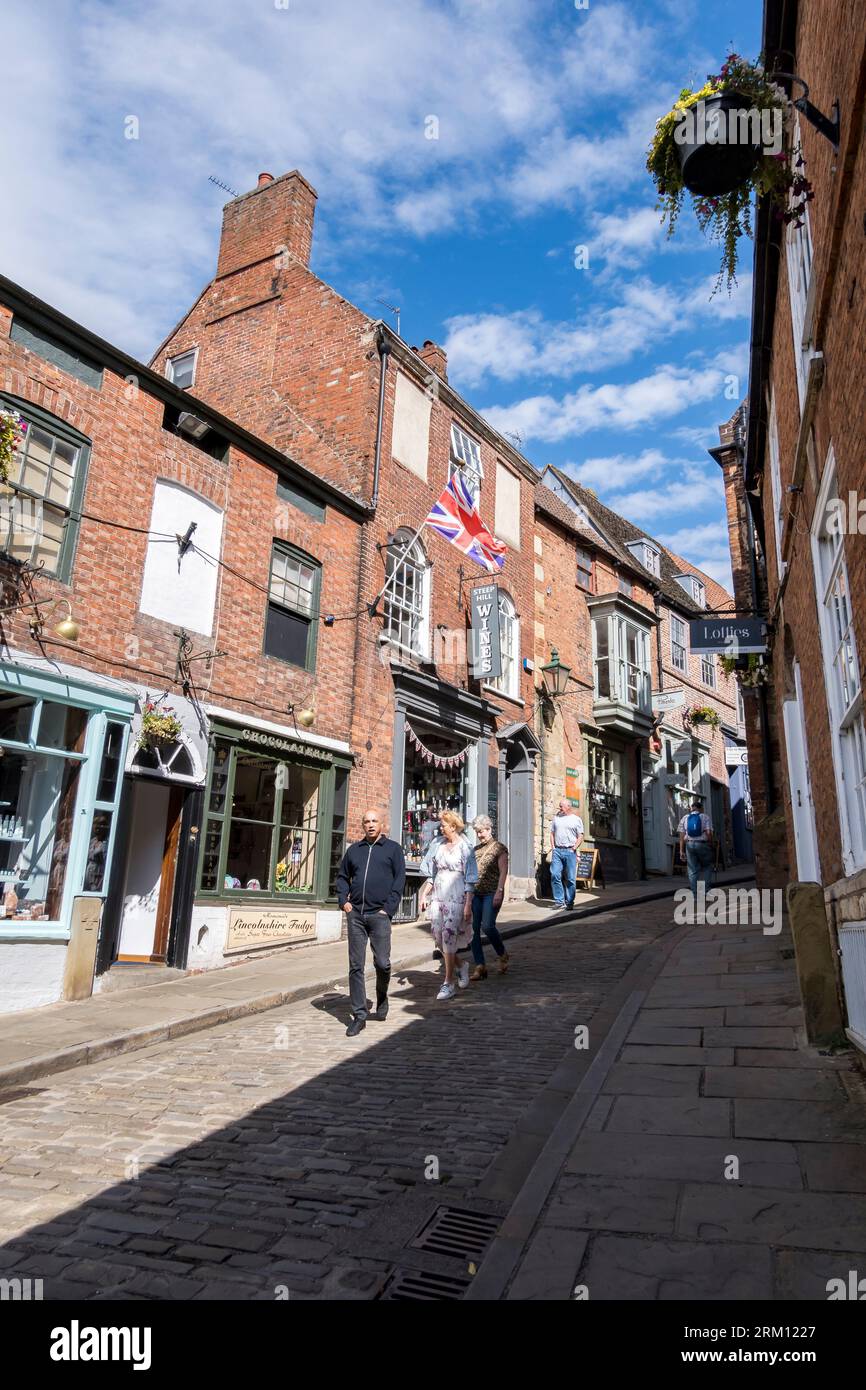 West side of upper Steep Hill in sunshine, Lincoln City, Lincolnshire, England, UK Stock Photo