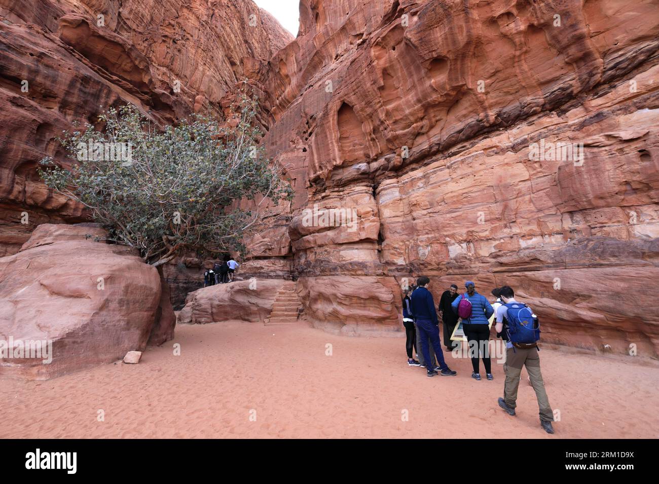 People in the Khazali canyon, famous for the ancient inscriptions and