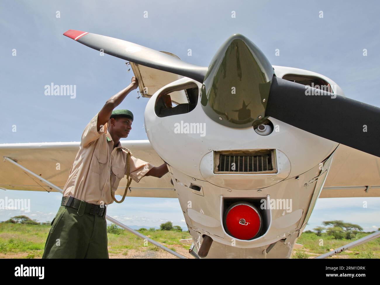 Bildnummer: 59560682  Datum: 21.04.2013  Copyright: imago/Xinhua NAIROBI, April, 2013 - Peter Lempatu checks his airplane before a monitoring operation for Save the Elephant at Buffalo Spring National Reserve, north of Kenya, on April 21, 2013. Save the Elephants (STE) was founded by Iain Douglas-Hamilton, a zoologist known for his study of elephants, in northern Kenya in 1993. It works to sustain elephant population and preserve the habitats in which elephants are found, while at the same time fostering a heightened appreciation and visibility for elephants and their fragile existence. Resear Stock Photo
