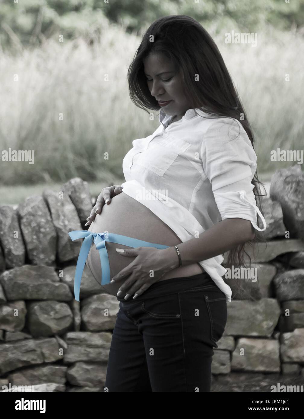 Partial Black and White photo of a Maternity shoot of a Mexican that's pregnant Stock Photo