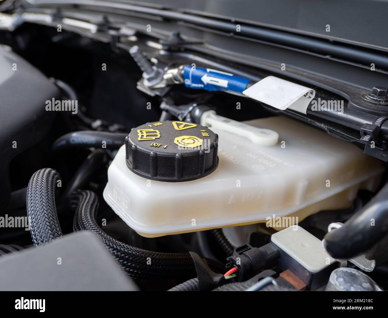 Automotive brake fluid tank. Closeup of the brake fluid reservoir
