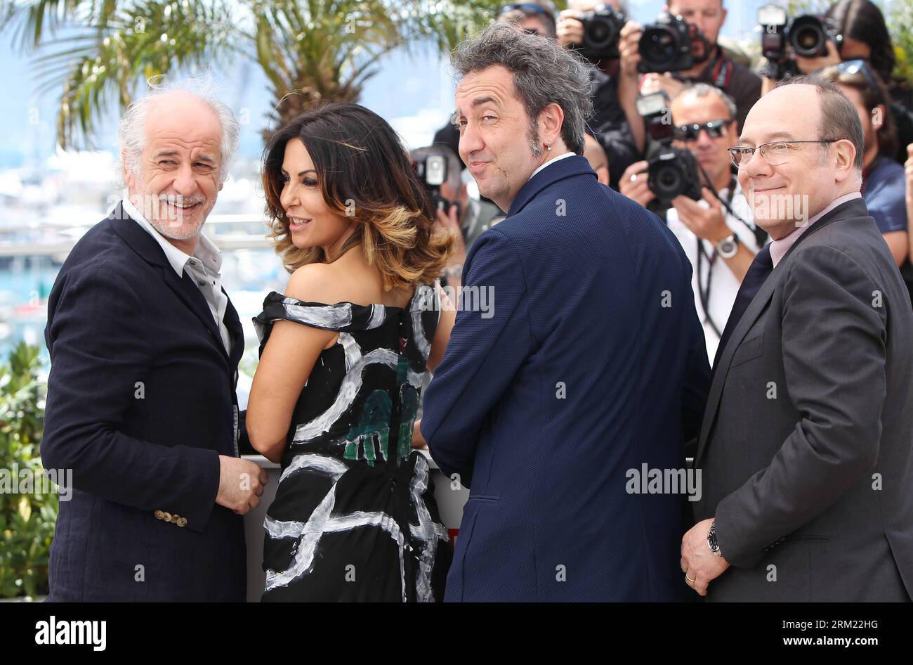 From L to R) Toni Servillo, Sabrina Ferilli, Paolo Sorrentino and Carlo  Verdone arrive at a photo call for the film La Grande Bellezza (The Great  Beauty) during the 66th annual Cannes