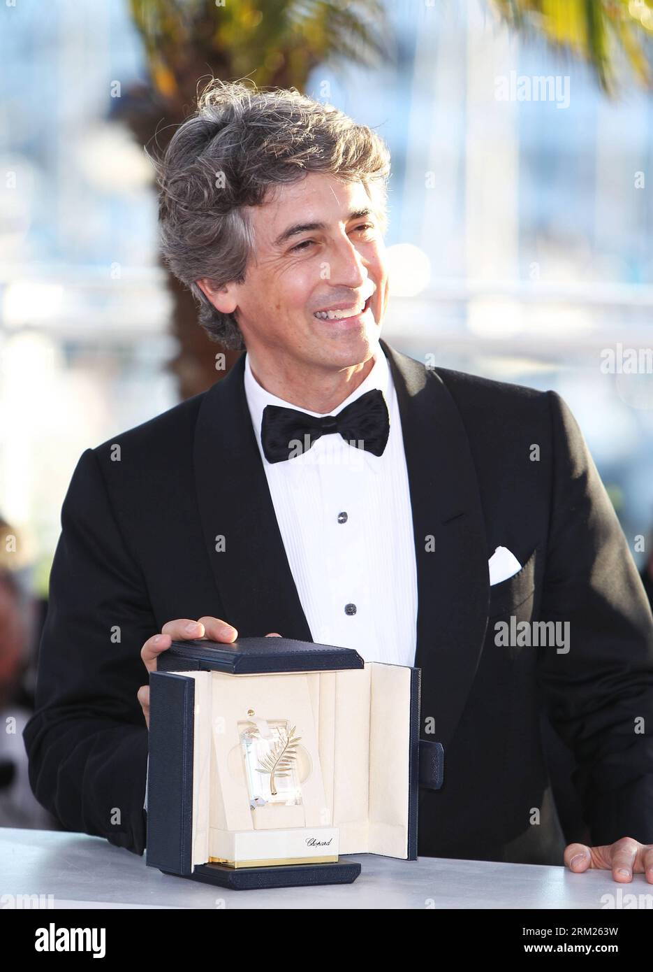 (130526) -- CANNES, May 26, 2012 (Xinhua) -- U.S. director Alexander Payne poses during a photocall with the Best Actor on behalf of U.S. actor Bruce Dern (not pictured) for the film Nebraska during a photocall at the 66th Cannes Film Festival in Cannes, France, on May 26, 2013. The festival ended here on Sunday night. (Xinhua/Gao Jing) FRANCE-CANNES-FILM FESTIVAL-AWARD PUBLICATIONxNOTxINxCHN   Cannes May 26 2012 XINHUA U S Director Alexander Payne Poses during a photo call With The Best Actor ON behalf of U S Actor Bruce Dern Not Pictured for The Film Nebraska during a photo call AT The  Cann Stock Photo