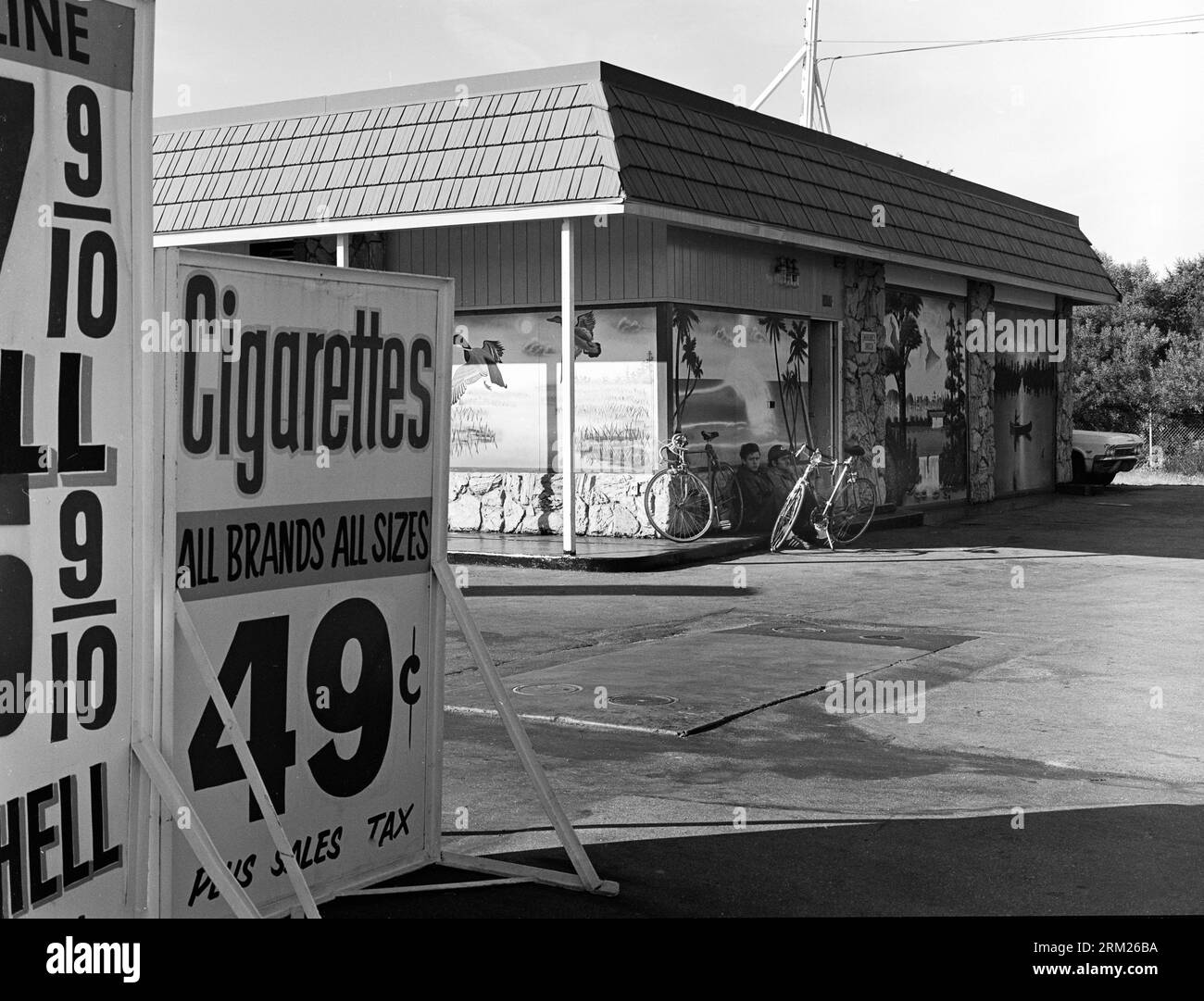 Gas Station, 1970s, with gas pumps and cigarette advertising Stock