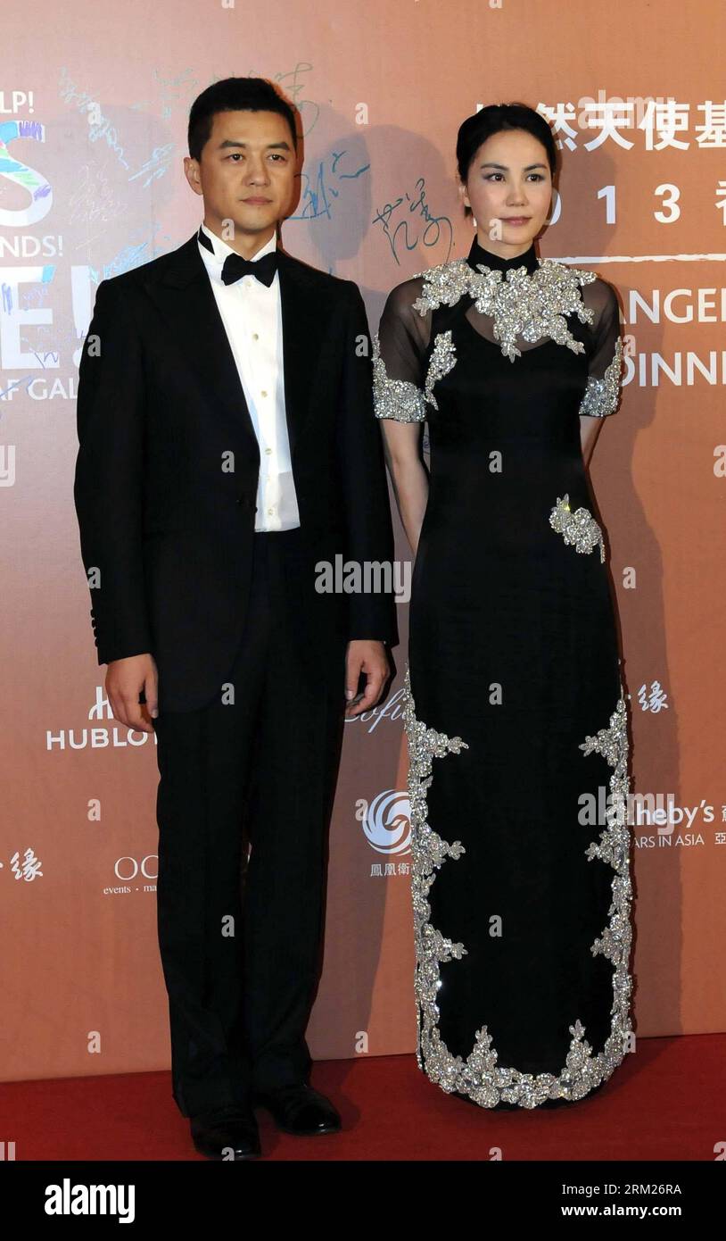 Bildnummer: 59720248  Datum: 27.05.2013  Copyright: imago/Xinhua Li Yapeng (L) and his wife Faye Wong attend the 2013 Gala Dinner of the SmileAngel Foundation in Hong Kong, south China, May 27, 2013. The dinner for celebrating the first anniversary of the establishment of the Beijing SmileAngel Children s Hospital raised 56.196 million Hong Kong dollars Monday night. (Xinhua/Zhu Xinyu) (zwx) (CORRECTION) CHINA-HONG KONG-SMILEANGEL FOUNDATION-GALA DINNER (CN) PUBLICATIONxNOTxINxCHN Entertainment People premiumd x0x xkg 2013 hoch     59720248 Date 27 05 2013 Copyright Imago XINHUA left Yapeng l Stock Photo