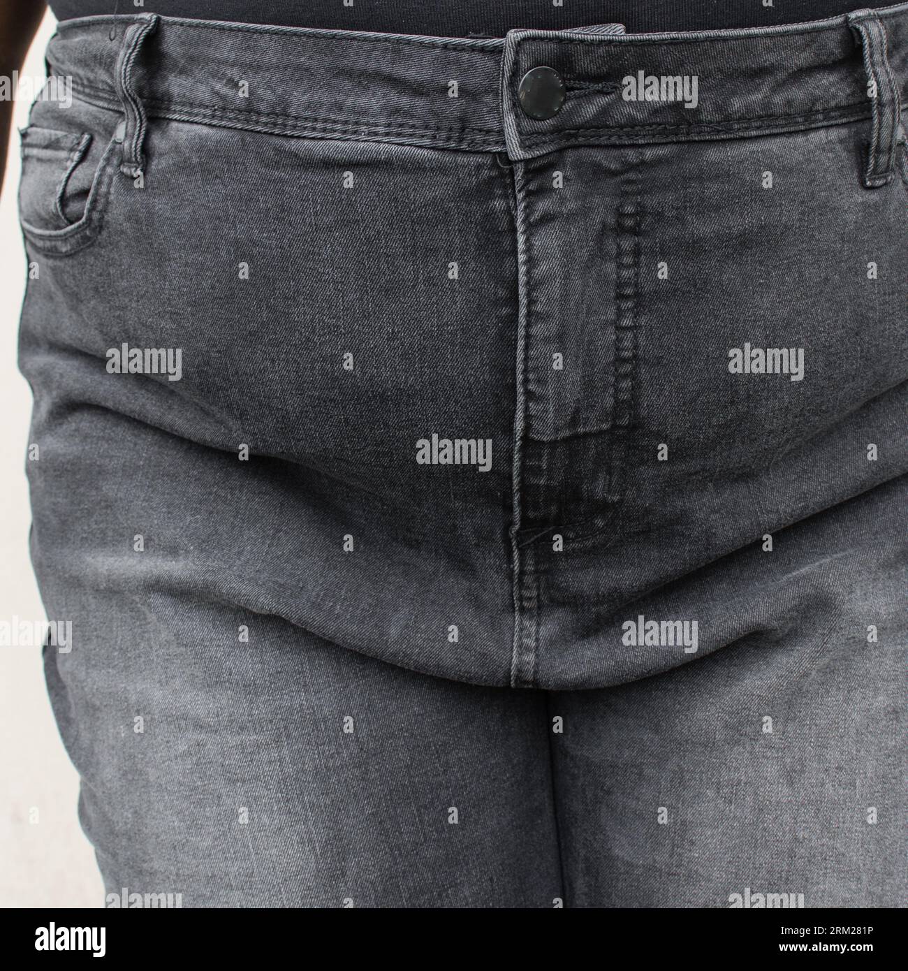 Overweight woman in jeans, woman with a fat upper pubic area in jean  trousers, A plus size girl with fupa in high waist denim trousers Stock  Photo - Alamy
