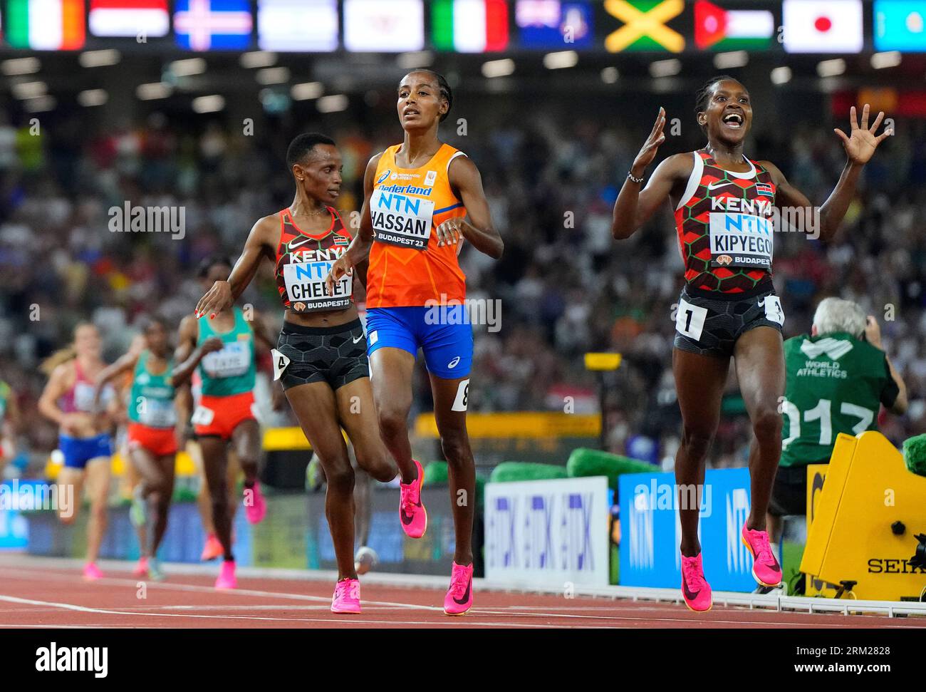 Faith Kipyegon, of Kenya celebrates as she wins the gold medal ahead of