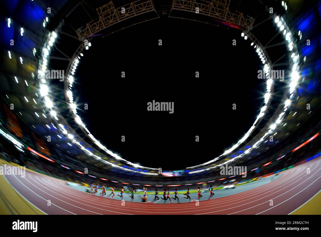 Athletes compete in the Women's 5000 Metres Final on day eight of the ...