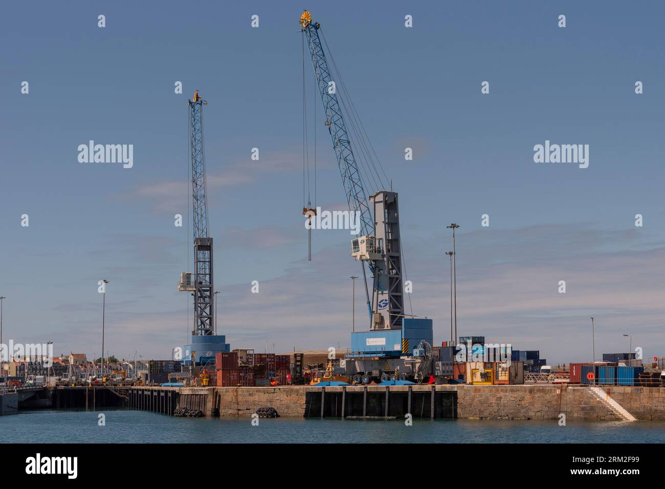 St Peter Port, Guernsey, Channel Islands. UK.  11 June 2023. Two large mobile cranes in the Port of Guernsey, Channel Islands. Stock Photo