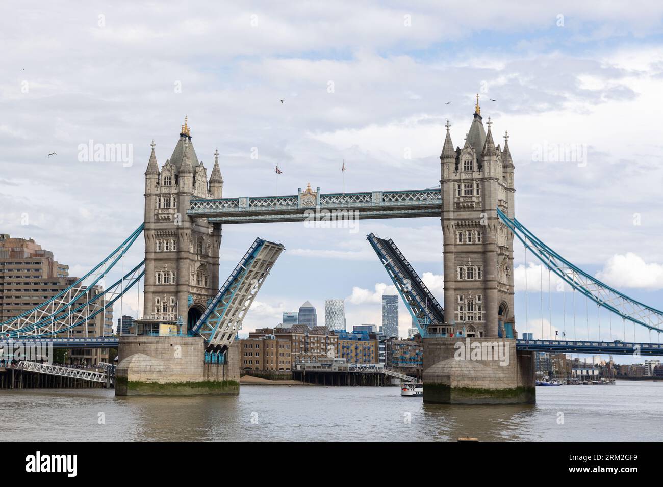 London's iconic Tower Bridge in its raised position Stock Photo - Alamy