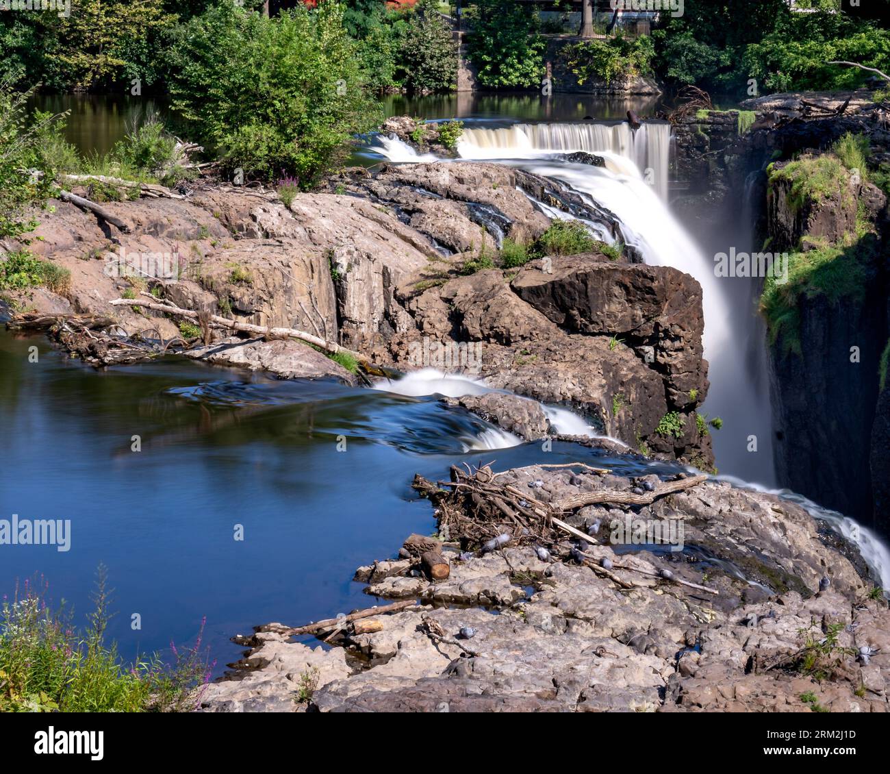 Paterson, NJ - US - Aug 20, 2023  Horizontal closeup view of the falls at the historic Paterson Great Falls National Historical Park during the summer Stock Photo