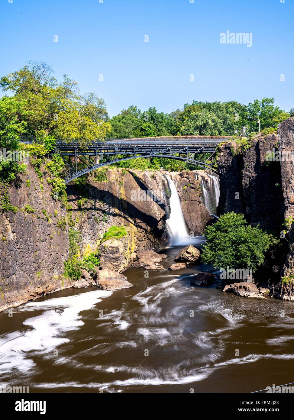 Paterson, NJ - US - Aug 20, 2023  Vertical view of the falls at the historic Paterson Great Falls National Historical Park during the summer. Stock Photo