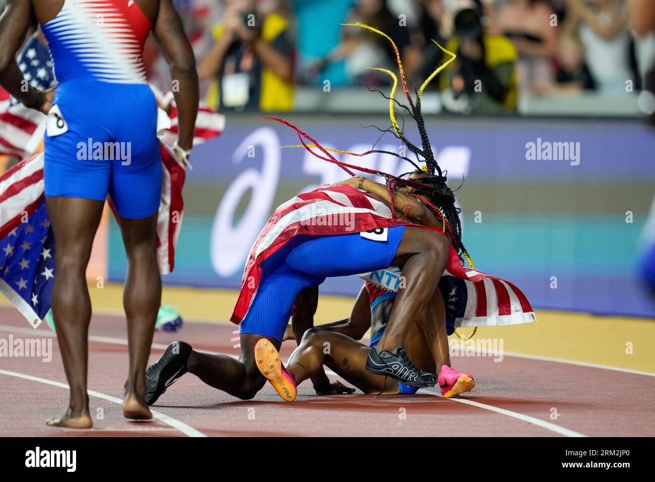 Sha'Carri Richardson, of the United States is greeted by members of the