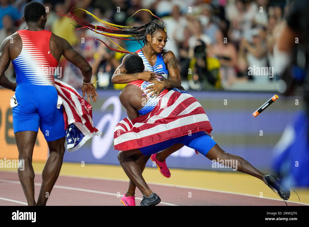Sha'Carri Richardson, of the United States is greeted by a members of