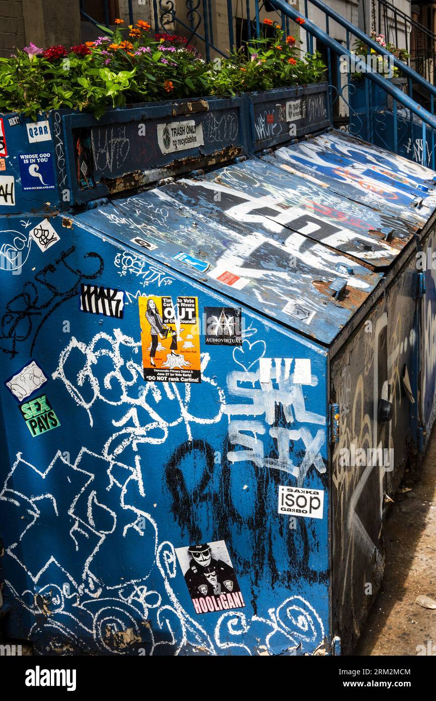 Colorful graffiti covers trash bin containers in Greenwich Village