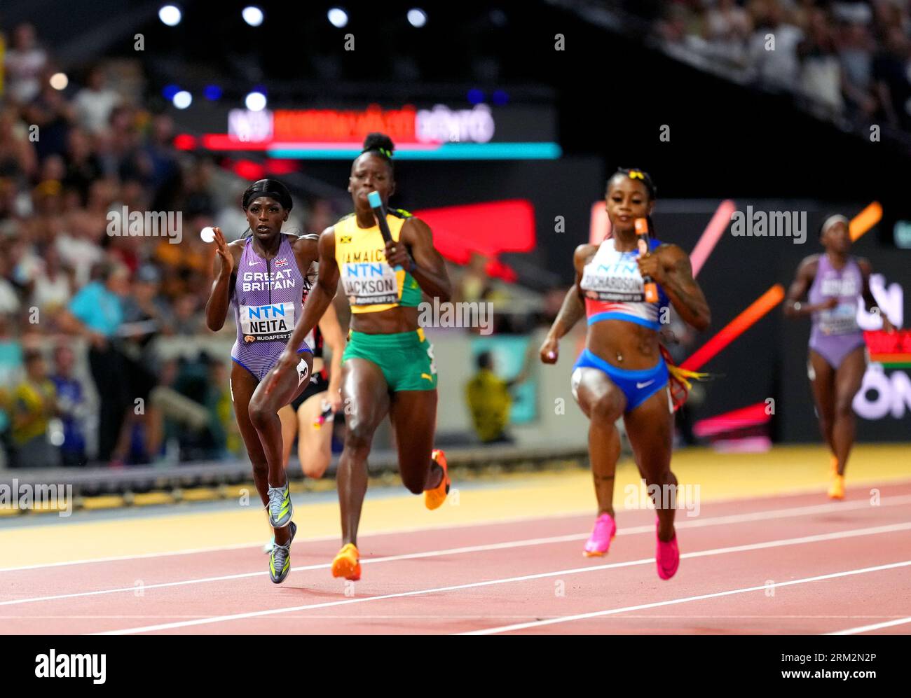 Great Britain's Daryll Neita (left) in action in the Women's 4x100