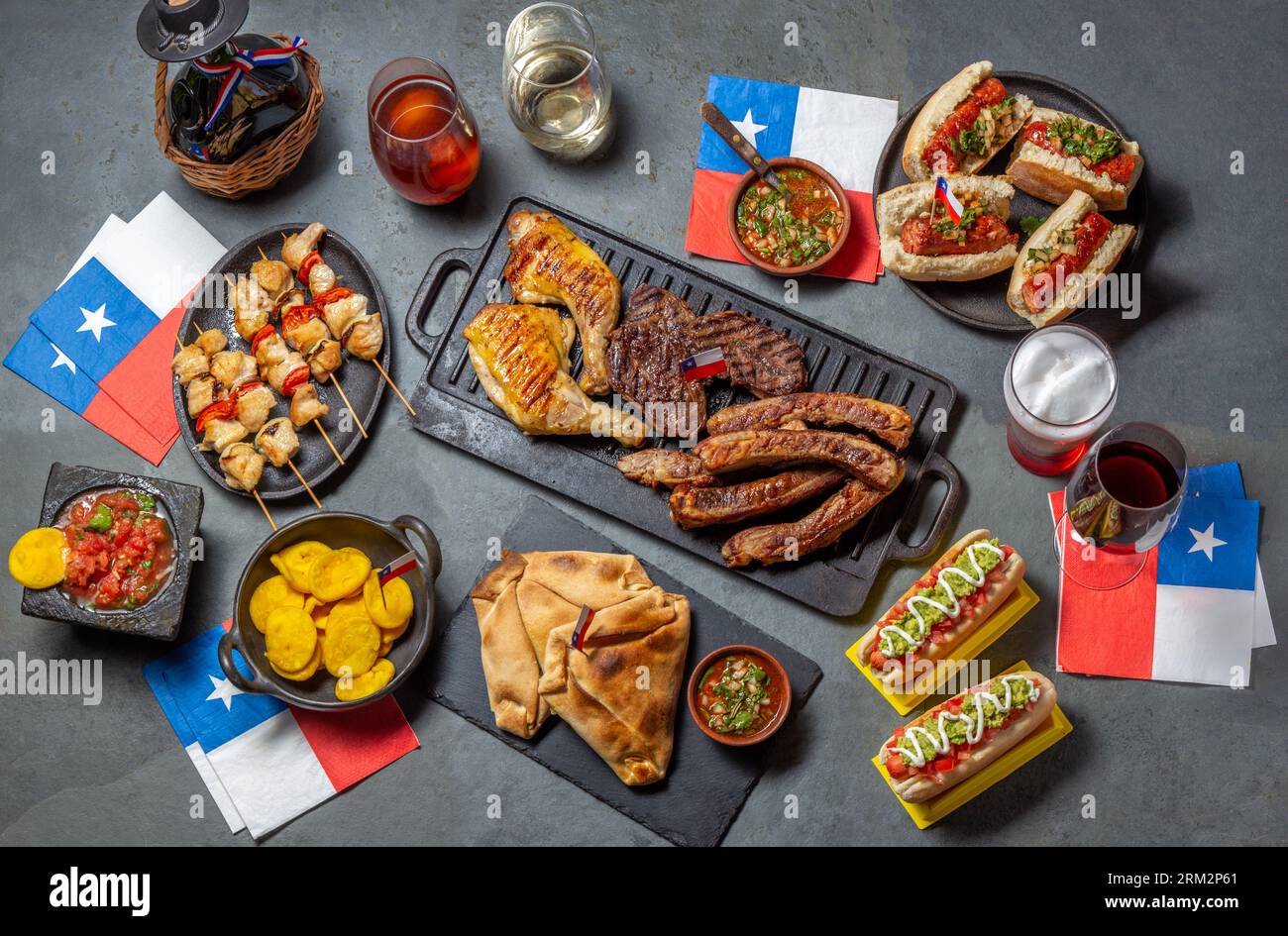 Chilean independence day table with traditional festive food for fiestas patrias. Dish and drink on 18 September party. Stock Photo