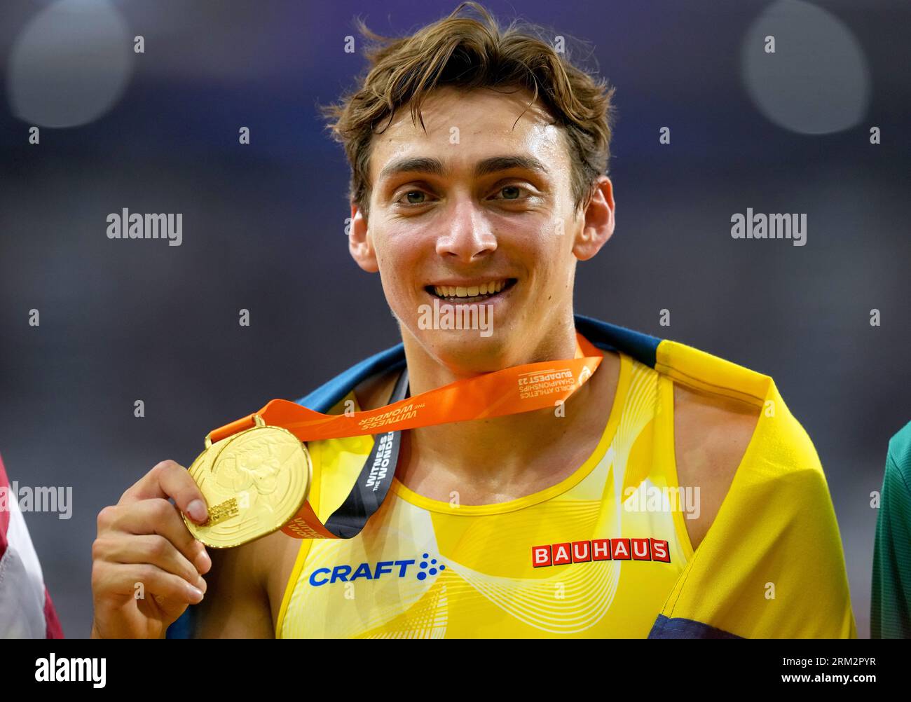 Sweden's Armand Duplantis celebrates with his gold medal after winning