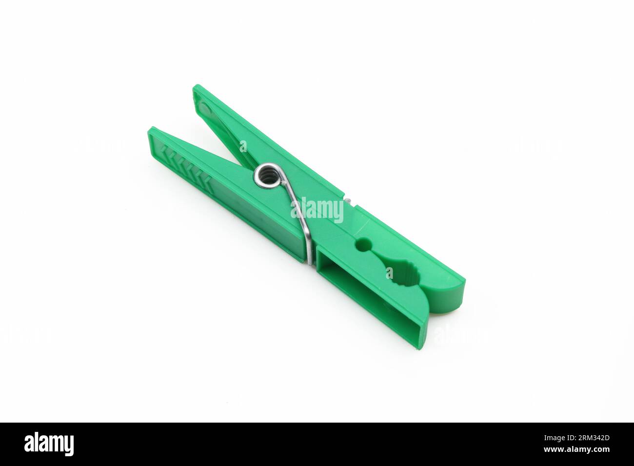Plastic green clothespin isolated on white background Stock Photo
