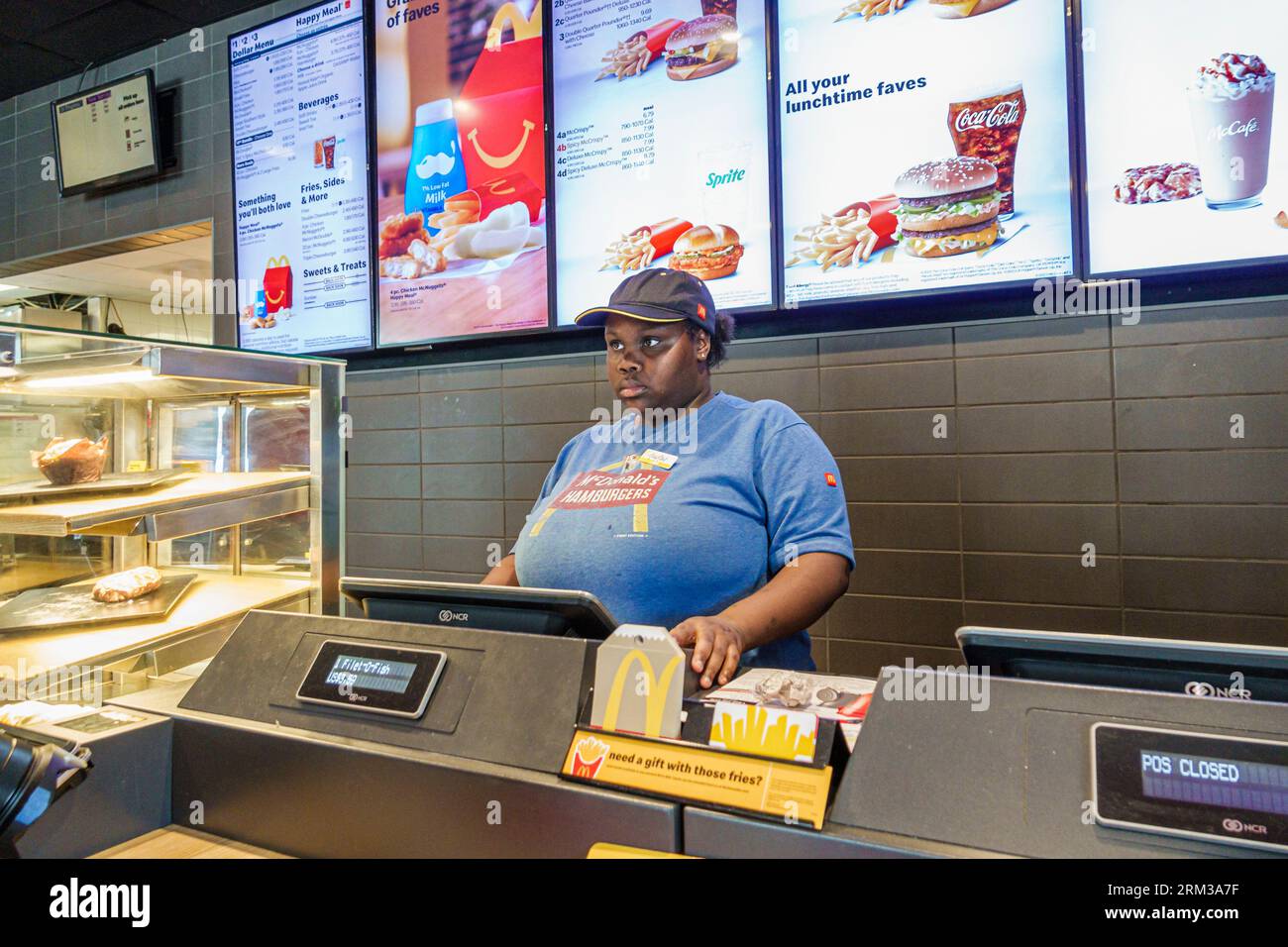 Glennville Georgia,McDonald's fast food,counter cashier,Black African,ethnic ethnicity,minority,resident,woman women lady female,adult,inside interior Stock Photo