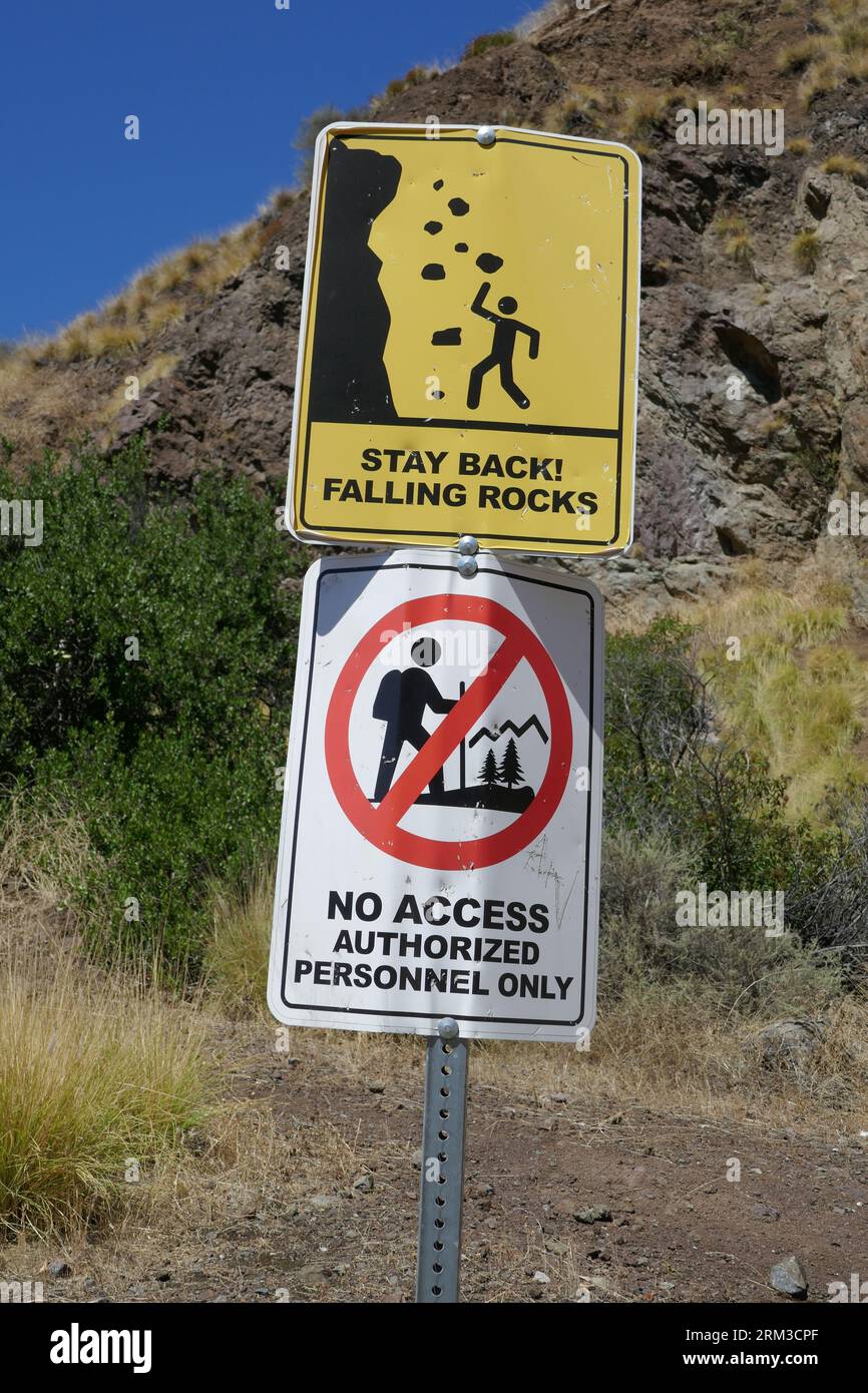 Los Angeles, California, USA 22nd August 2023 Rock Climbing is Prohibited Sign and Caution Falling Rocks Sign at Bronson Caves Park, where Batman TV Series Bat Cave, The Scorpion King, Star Trek, Creature from the Black Lagoon, Hail Caesar, Army of Darkness, Julius Caesar with Marlon Brando, Flash Gordon, Superman, Cabin Fever, Power Rangers, George of the Jungle, many more filmed at Bronson Caves on August 22, 2023 in Los Angeles, California, USA. Photo by Barry King/Alamy Stock Photo Stock Photo