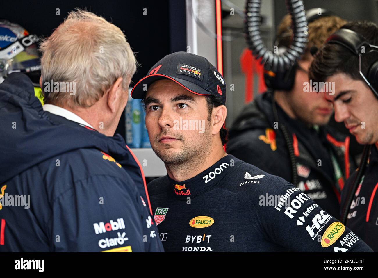 26th August 2023; Circuit Zandvoort, Zandvoort, North Holland, Netherlands; Formula 1 Heineken Dutch Grand Prix 2023; Qualifying Day; Sergio Perez (MEX) listens to Helmut Marko who will be instrumental in deciding his future with Oracle Red Bull Racing Stock Photo