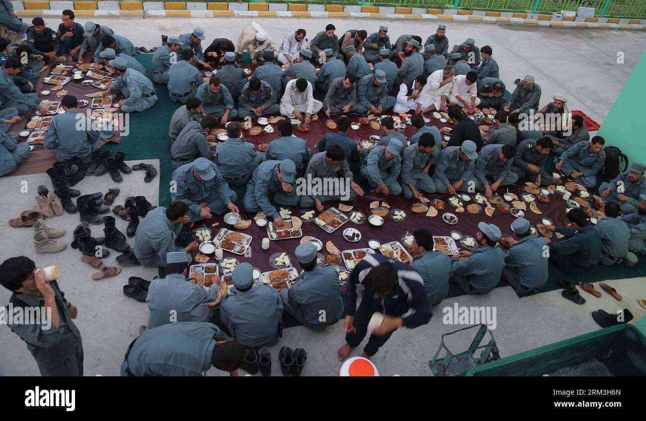 Bildnummer: 60179663  Datum: 24.07.2013  Copyright: imago/Xinhua (130724) -- GHAZNI, July 24, 2013 (Xinhua) -- Afghan policemen break their fast in a police station during holy month of Ramadan in Ghazni province, eastern Afghansitan, on July 24, 2013. Ramadan or fasting month is the holiest month in Muslim calendar. During the month, refrain from eating, drinking and smoking from sunrise to sunset. (Xinhua/Rahmat) (dzl) AFGHANISTAN-GHAZNI-POLICE-RAMADAN PUBLICATIONxNOTxINxCHN Gesellschaft Polizei Fastenbrechen premiumd x0x xsk 2013 quer      60179663 Date 24 07 2013 Copyright Imago XINHUA  Gh Stock Photo