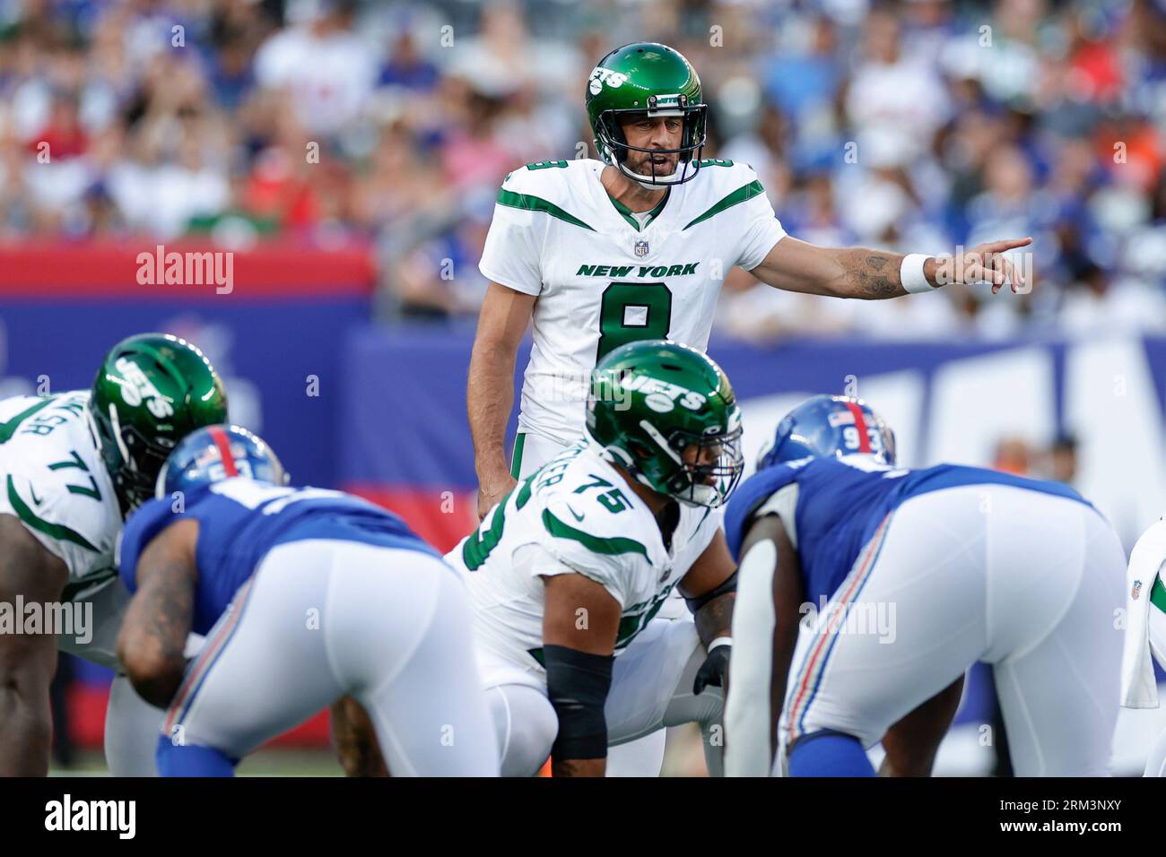 New York Jets quarterback Aaron Rodgers (8) calls to his teammates during  the first half of an NFL preseason football game against the New York Giants,  Saturday, Aug. 26, 2023, in East