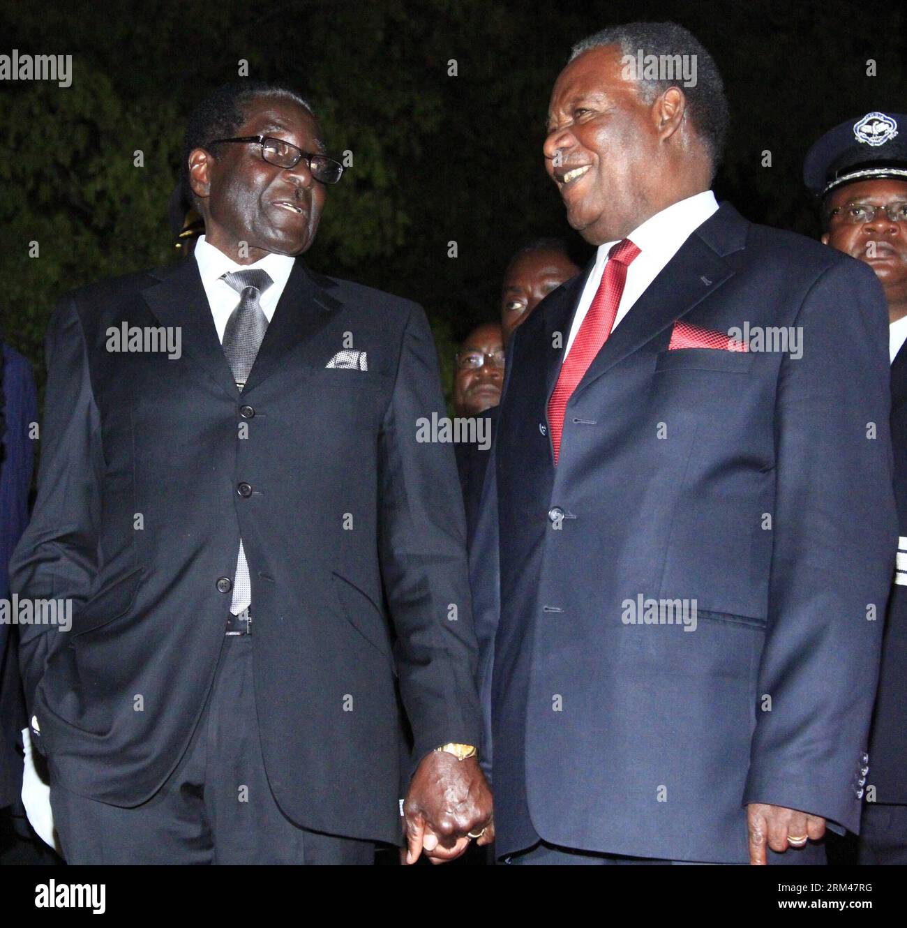 Bildnummer: 60392010  Datum: 25.08.2013  Copyright: imago/Xinhua VICTORIA FALLS, Aug. 25, 2013 - Zambian President Michael Sata (R) and his Zimbabwean counterpart Robert Mugabe attend the opening ceremony of the 20th session of the UNWTO General Assembly in Victoria Falls city, Zimbabwe, Aug. 25, 2013. Zimbabwe and Zambia co-hosted the 20th session of the UNWTO General Assembly, the first time for southern Africa and second time for sub-Saharan Africa to host the event. (Xinhua) ZIMBABWE-VICTORIA FALLS-UNWTO-OPENING PUBLICATIONxNOTxINxCHN People Politik xcb x0x 2013 quadrat premiumd     603920 Stock Photo