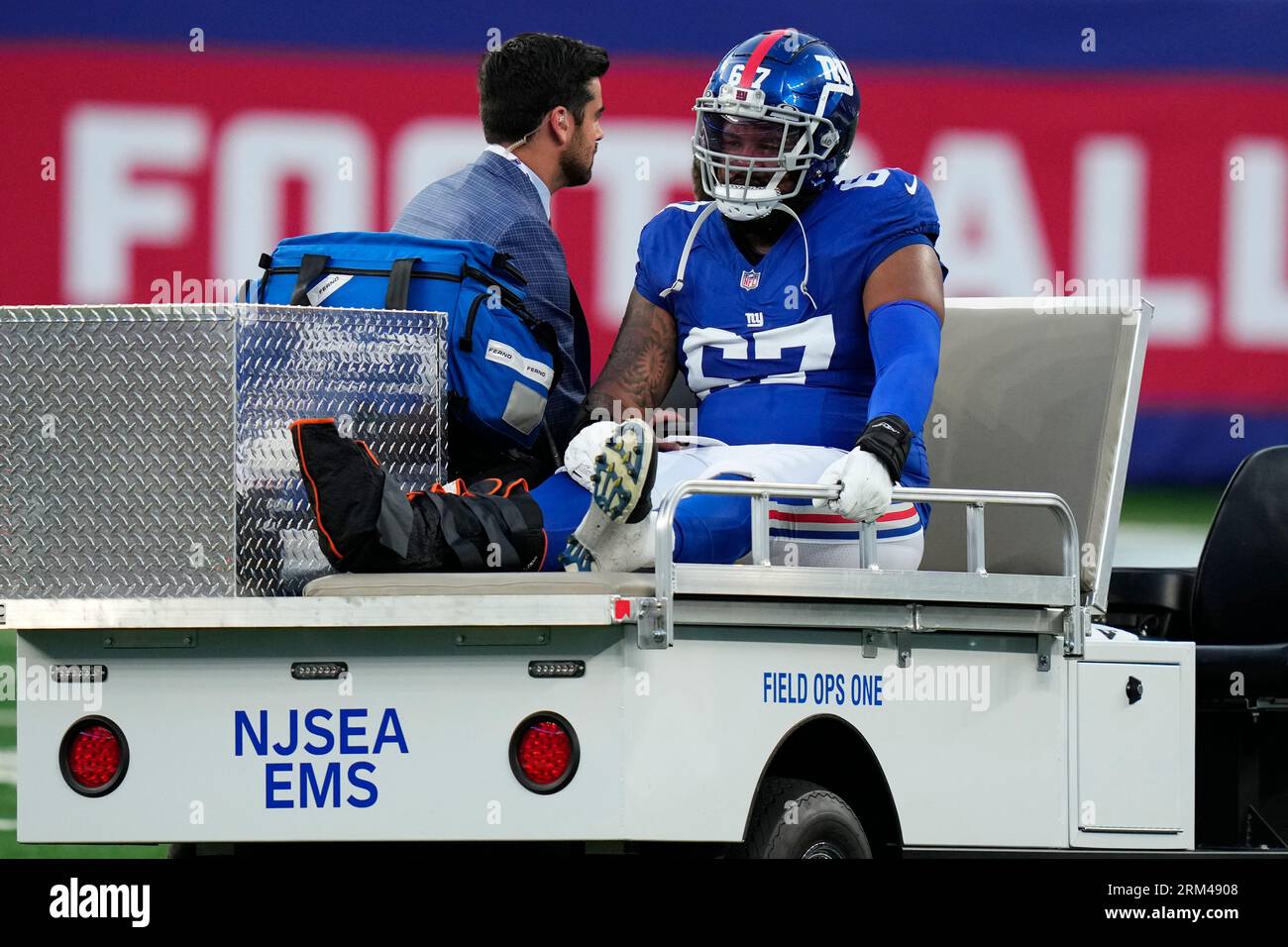 New York Giants guard Wyatt Davis (67) is carted off the field after an  apparent injury during the first half of an NFL preseason football game  against the New York Jets, Saturday,