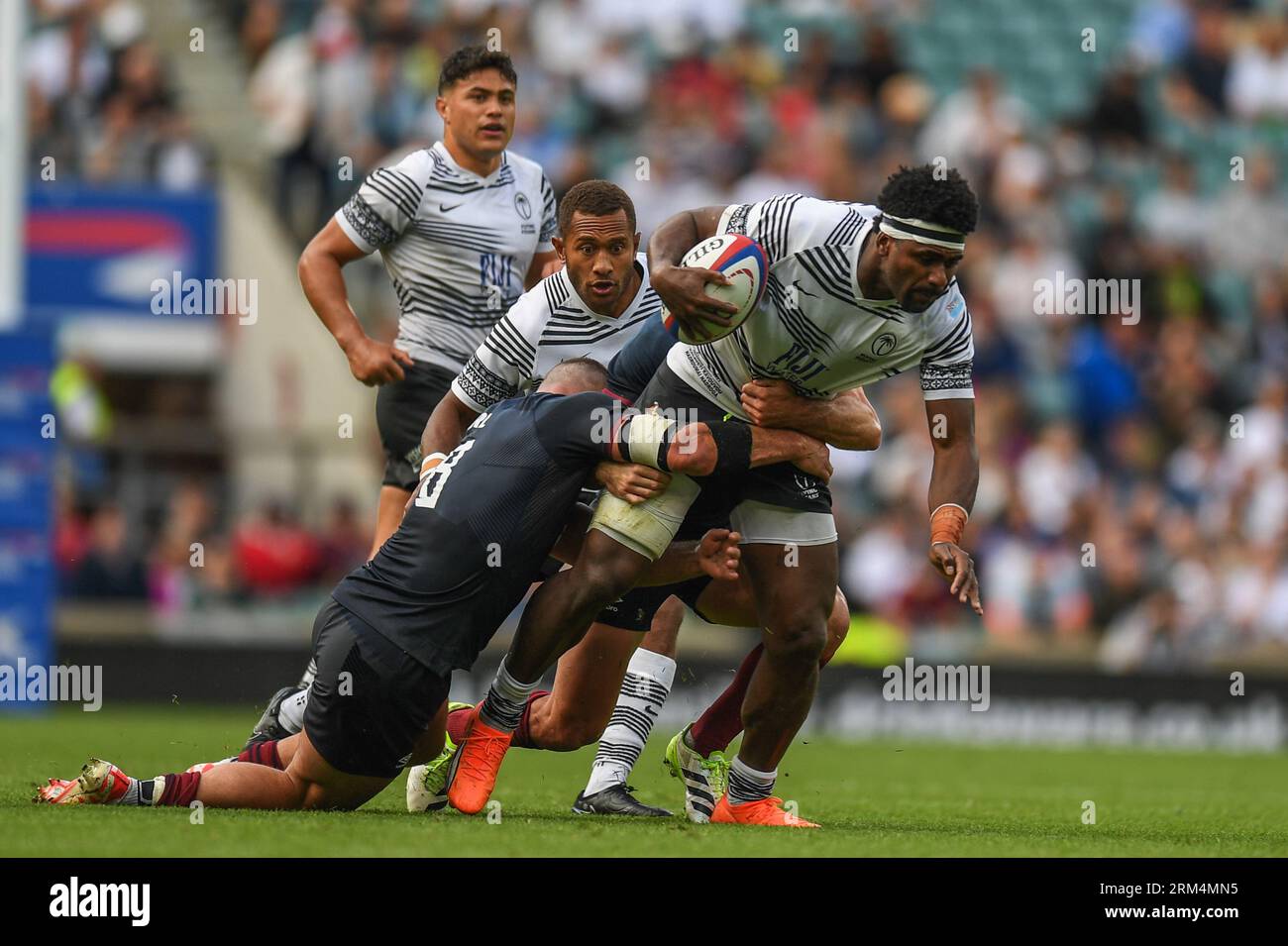 Kalaveti Ravouvou of Fiji tackled by Ben Earl of England during the