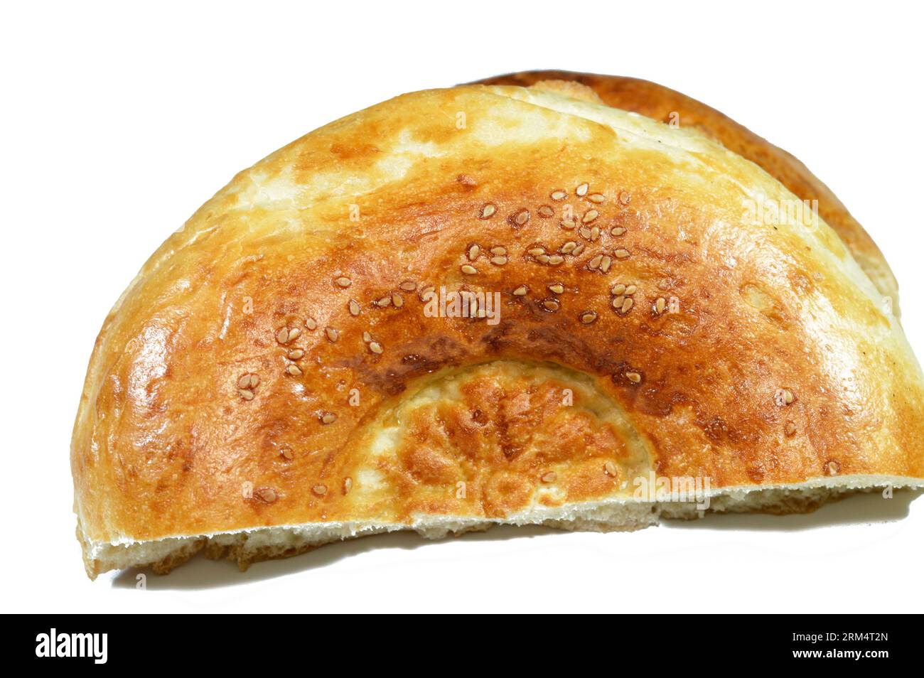 Tandyr nan Uzbek bread, a type of Central Asian bread, often decorated by stamping patterns on the dough by using a bread stamp known as a chekich, al Stock Photo