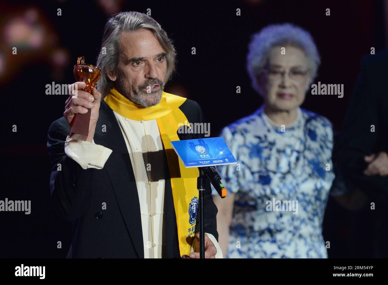 MACAO, Oct. 7, 2013 - British actor Jeremy Irons L receives the Lifetime Achievement award at the awarding ceremony of the 10th Huading Awards, the release ceremony of the Global Entertainment Celebrities Satisfaction Survey, in Macao, south China, Oct. 7, 2013. Xinhua/Cheong Kam Ka wr CHINA-MACAO-HUADING AWARDS CN PUBLICATIONxNOTxINxCHN Stock Photo