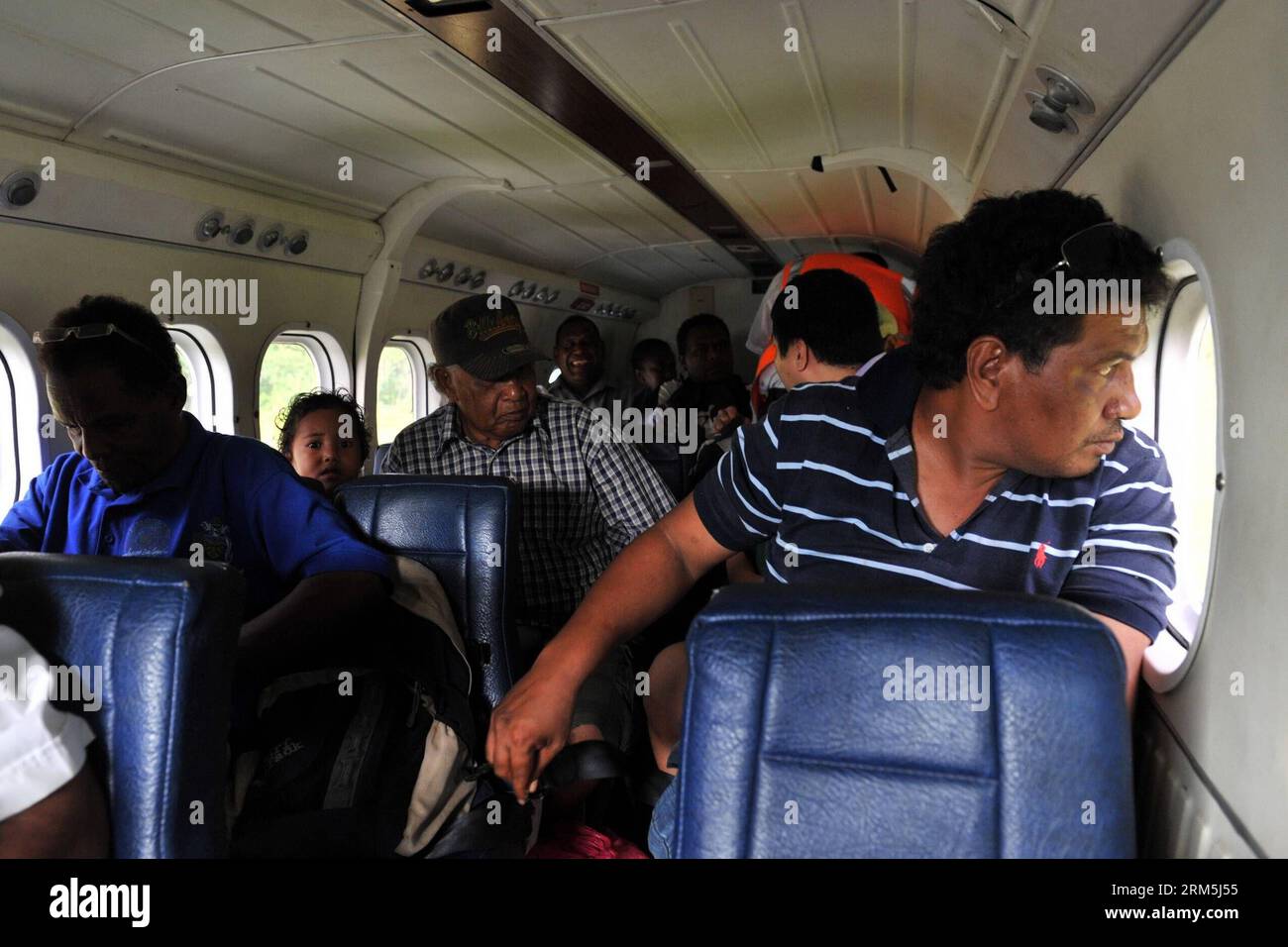 Bildnummer: 60668792  Datum: 29.10.2013  Copyright: imago/Xinhua Passengers are on board of a Twin Otter lightplane which has served 30 years in Solomon Islands, Oct. 29, 2013. The Solomon Airlines owns a history of more than 50 years. The DHC 8-102 , Twin Otter and Islander are three kinds of vintage lightplanes serving for national flights which can respectively carry 36, 16 and 9 passengers. Most of these planes have served more than ten years or even dozens of years. (Xinhua/Gao Jianjun) SOLOMON ISLANDS-SOLOMON AIRLINES-VINTAGE LIGHTPLANES PUBLICATIONxNOTxINxCHN Gesellschaft x0x xsk 2013 q Stock Photo