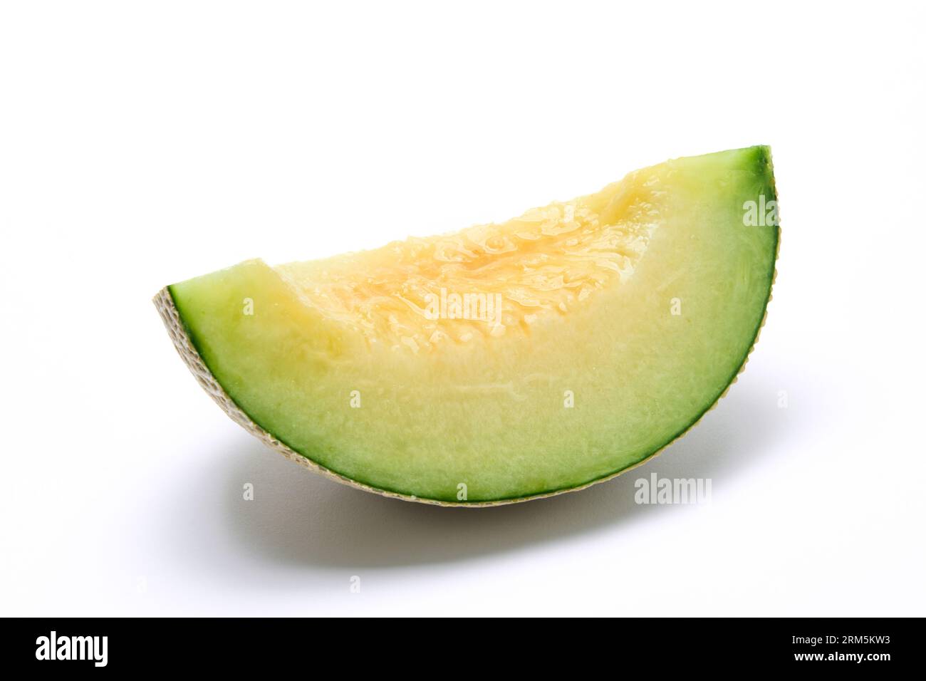 Earl's melon cut in quarters, photographed against a white background Stock Photo Alamy