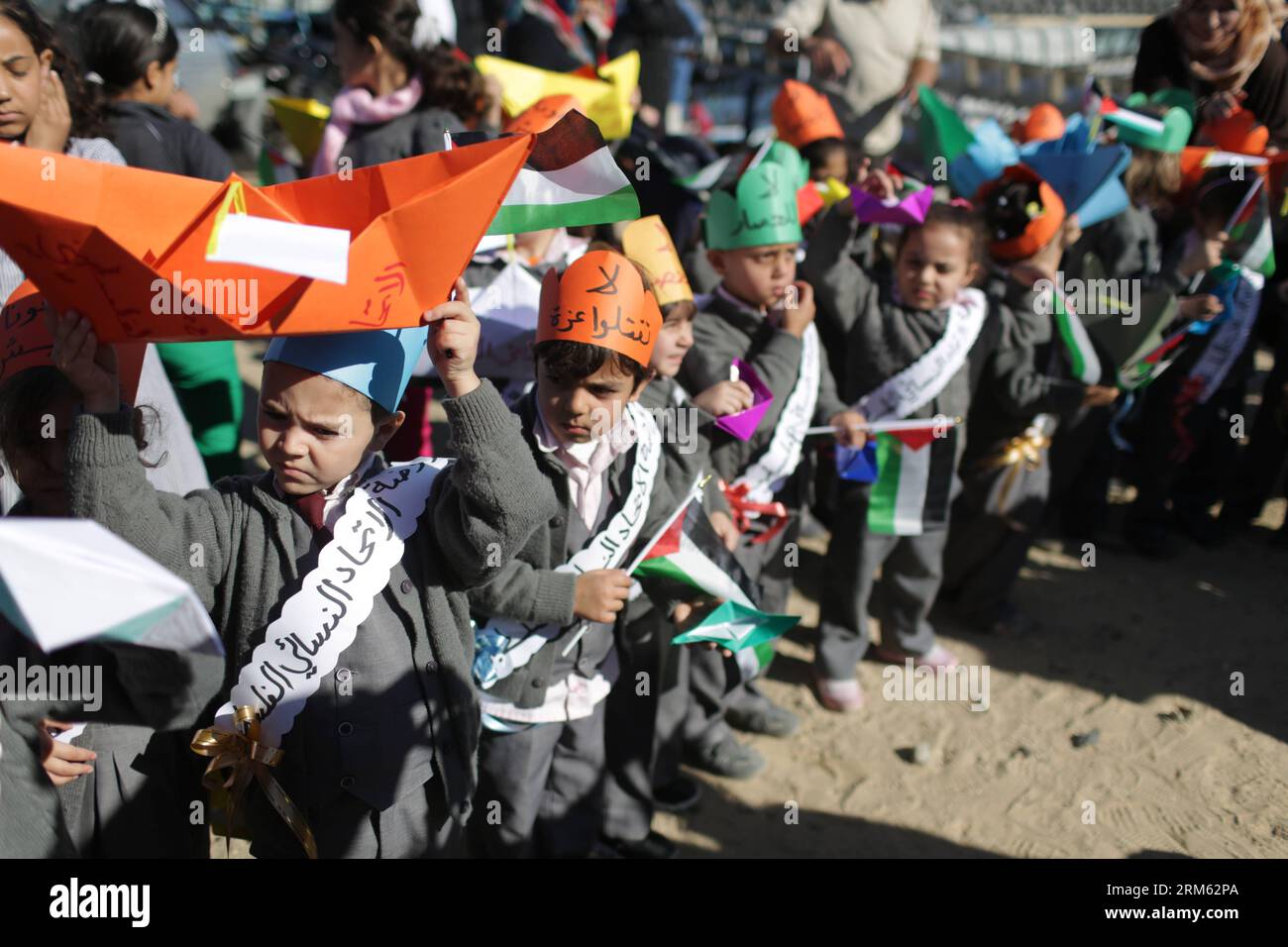 Bildnummer: 60775402  Datum: 30.11.2013  Copyright: imago/Xinhua     Palestinian children hold banners and Palestinian national flags during a protest against Israel s maritime blockade on the Gaza Strip at a port in Gaza City, Nov. 30, 2013. (Xinhua/Wissam Nassar) MIDEAST-GAZA-PROTEST PUBLICATIONxNOTxINxCHN Gesellschaft Politik Demo Protest xcb x0x 2013 quer premiumd Stock Photo