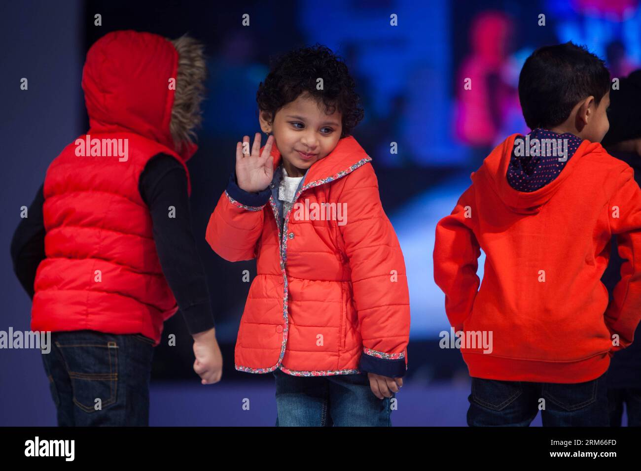 Bildnummer: 60823349  Datum: 12.12.2013  Copyright: imago/Xinhua     Children display clothes at a fashion show in Bathinda, Punjab of India, Dec. 12, 2013. An open-air fashion show displaying clothes with affordable prices was held here on Thursday, attracting many. (Xinhua/Zheng Huansong) INDIA-PUNJAB-BATHINDA-FASHION SHOW PUBLICATIONxNOTxINxCHN Gesellschaft x2x xkg 2013 quer o0 Mode Modenschau Entertainment o00 Kindermodenschau Stock Photo